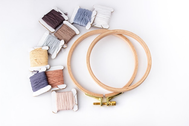 Assortment of embroidery threads and hoops